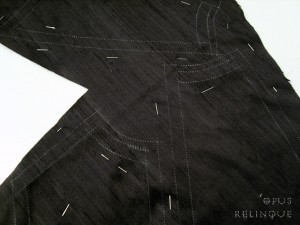 Using carbon and roulette for copying patterns onto raw silk fabric.